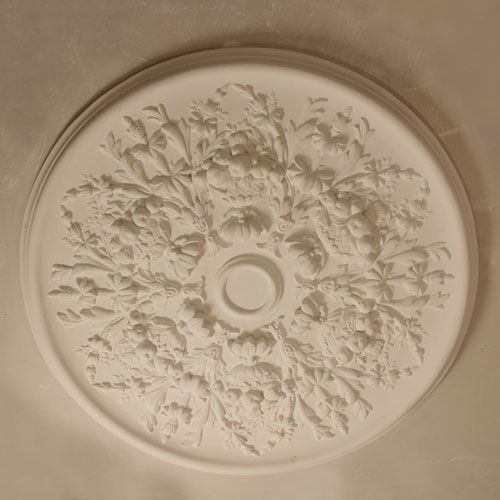 CR17 Ceiling Rose is a medium sized ceiling centre with fruit enrichment and multi leaf motifs and a plain bar to the outer banding. 