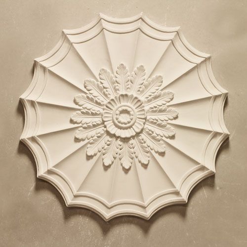 CR11 Ceiling Rose is an Adams design small oval fibrous plaster centrepiece with open flutes overlaid with leaf enrichment with plain central boss. Dimensions: 460mm
