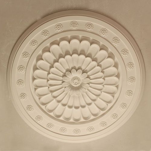 Medium sized rose with multi layered central leaves and patarae to outer edge. A standard fibrous plaster moulding.