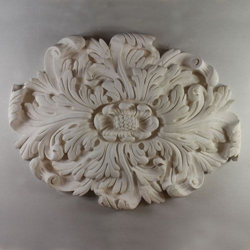 CR24 Ceiling Rose is a medium oval leaf rose with sinuous leaf design and ornate central boss. A standard fibrous plaster moulding. Dimensions: 600mm/415mm