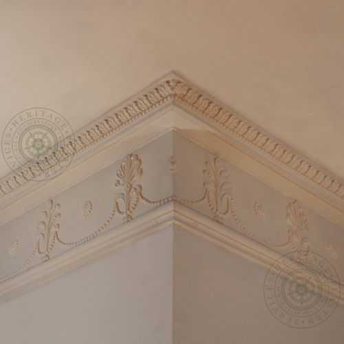 HPS39 Cornice “Rosslyn” is an enriched frieze type fibrous plaster moulding with a fine upright leaf to the top member and a swag and drop style design to the wall plate. 