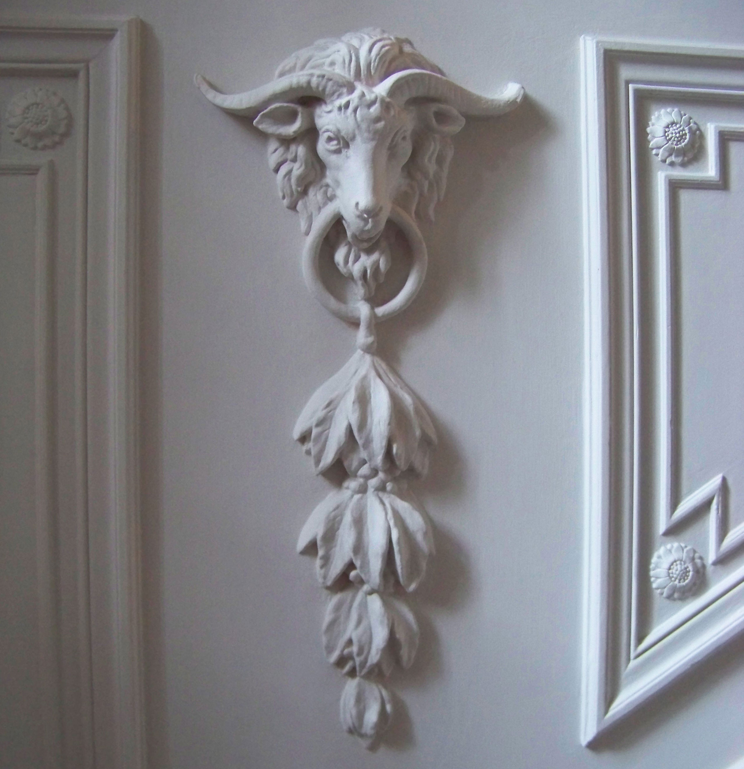 Rams head ornamentation in plaster